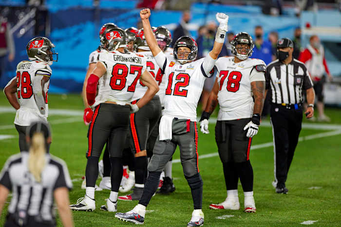 Tom Brady raises his arms in celebration during Super Bowl LV